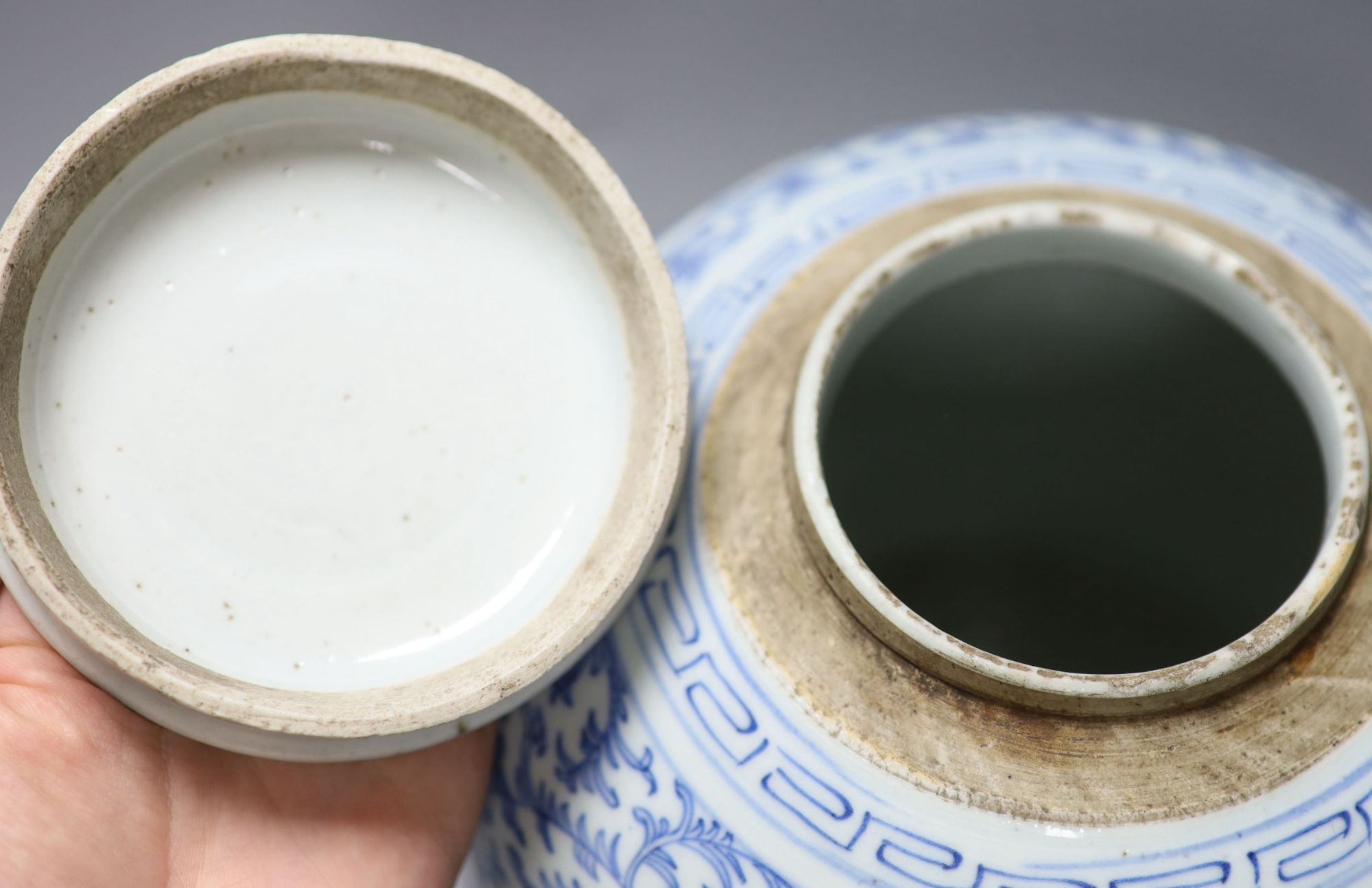 A 19th century Chinese blue and white jar, with associated cover, height 22cm